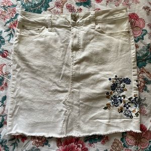 White skirt with embroidered flowers